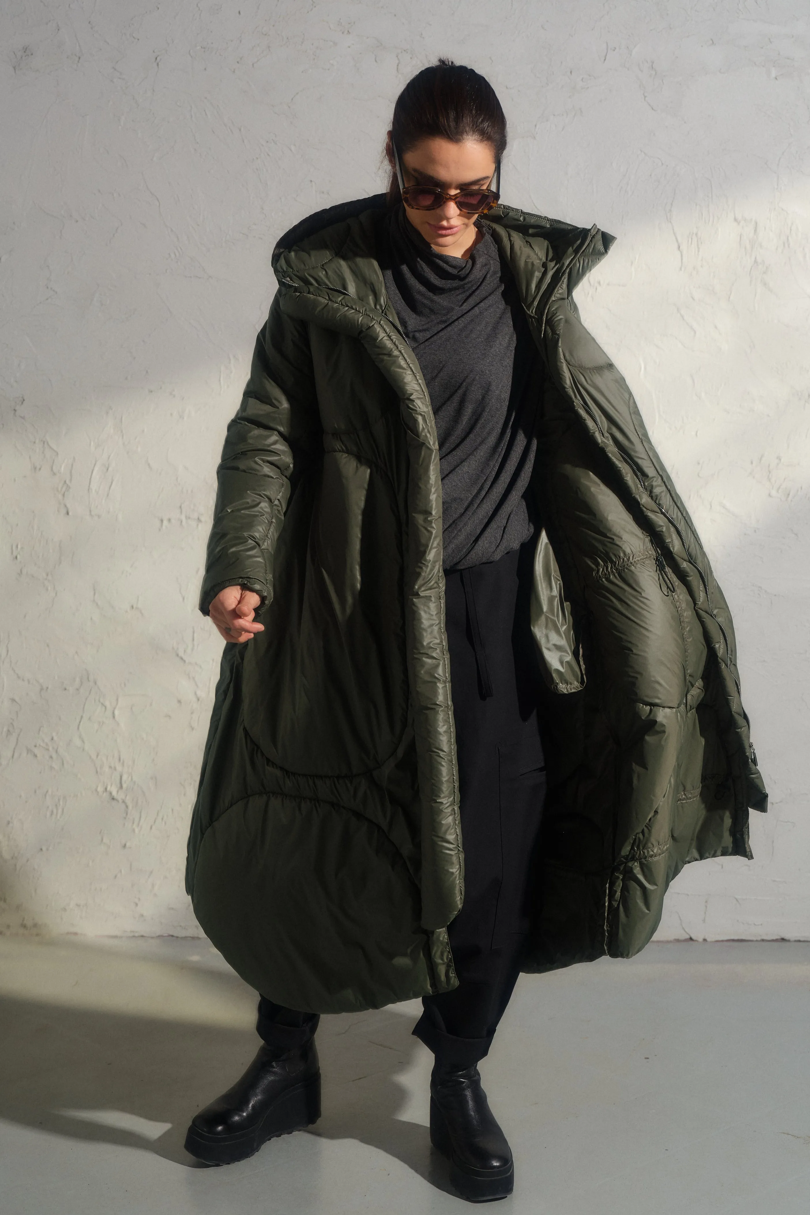 Avant garde transitional puffer jacket with hood