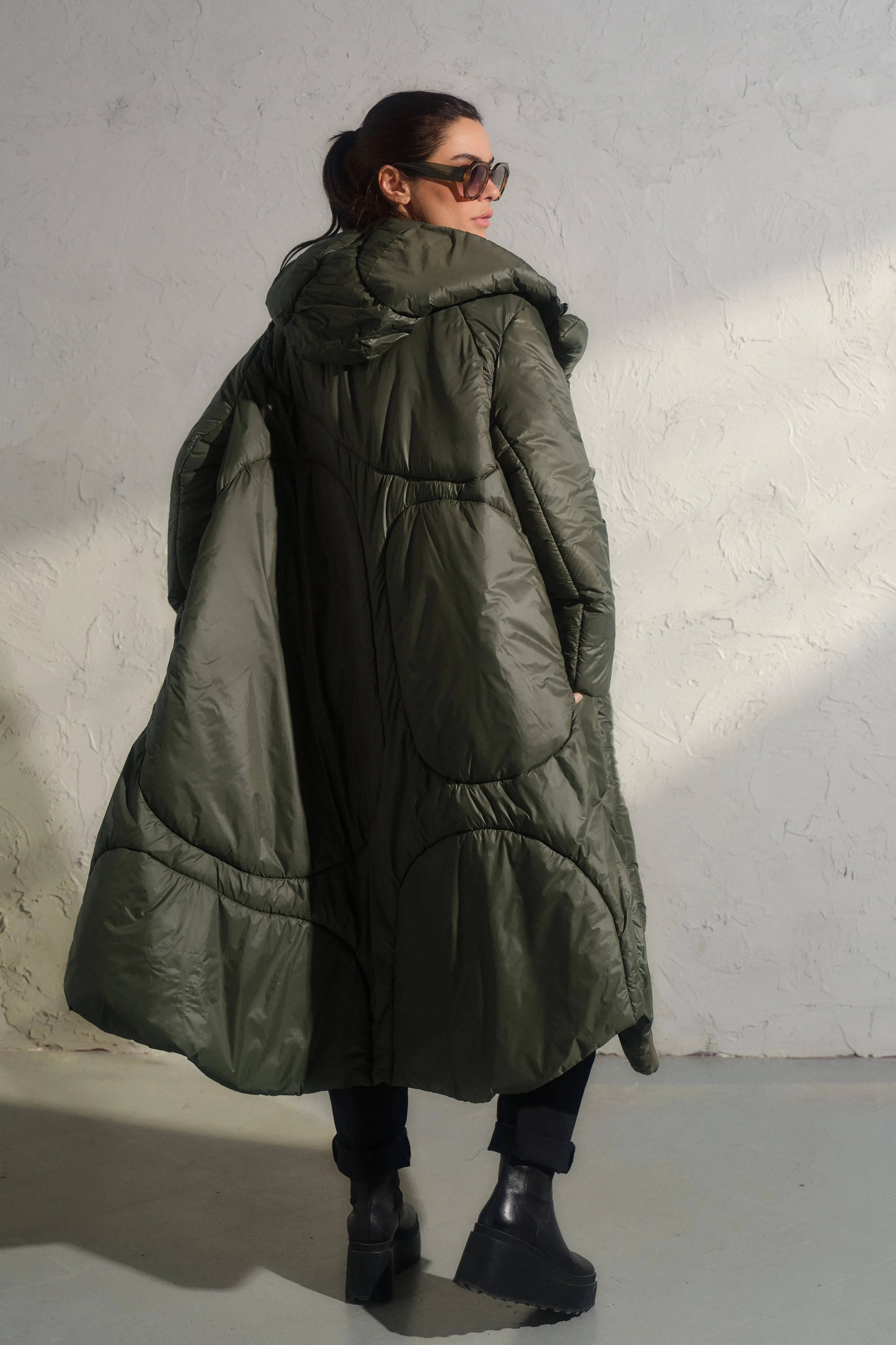 Avant garde transitional puffer jacket with hood